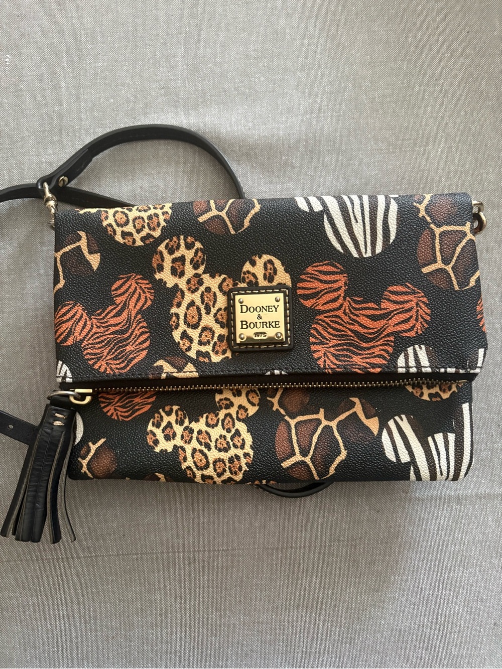 Dooney & Bourke Black Foldover Crossbody bag.  Animal Kingdom Anniversary Item